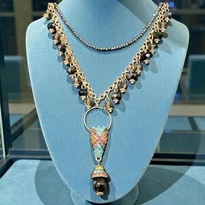 Heidi Daus art deco crystal pendant on a black & gold iridescent necklace